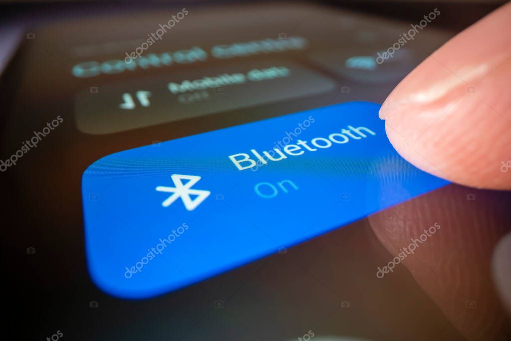 Melbourne, Australia - Oct 3, 2022: Close-up view of turning on Bluetooth on a smartphone, shot with macro probe lens