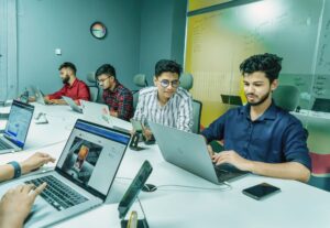 men working on laptop in coworking space